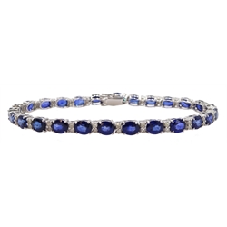  18ct white gold oval cut sapphire and round brilliant cut diamond bracelet, stamped 750, total sapphire weight approx 12.00 carat  