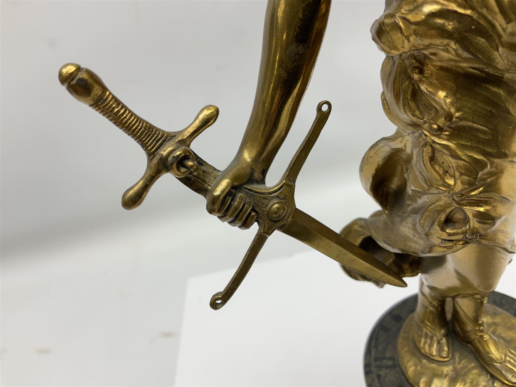 After Oswald Schimmelpfennig (German, 1872-1939): Pair of gilt bronze winged Allegorical female figures, the first example with arm outstretched holding a branch, signed 'Schimmelpfennig 1900', the second with arm raised above her head holding a book and sword in the other, both raised upon marble plinths, H45cm