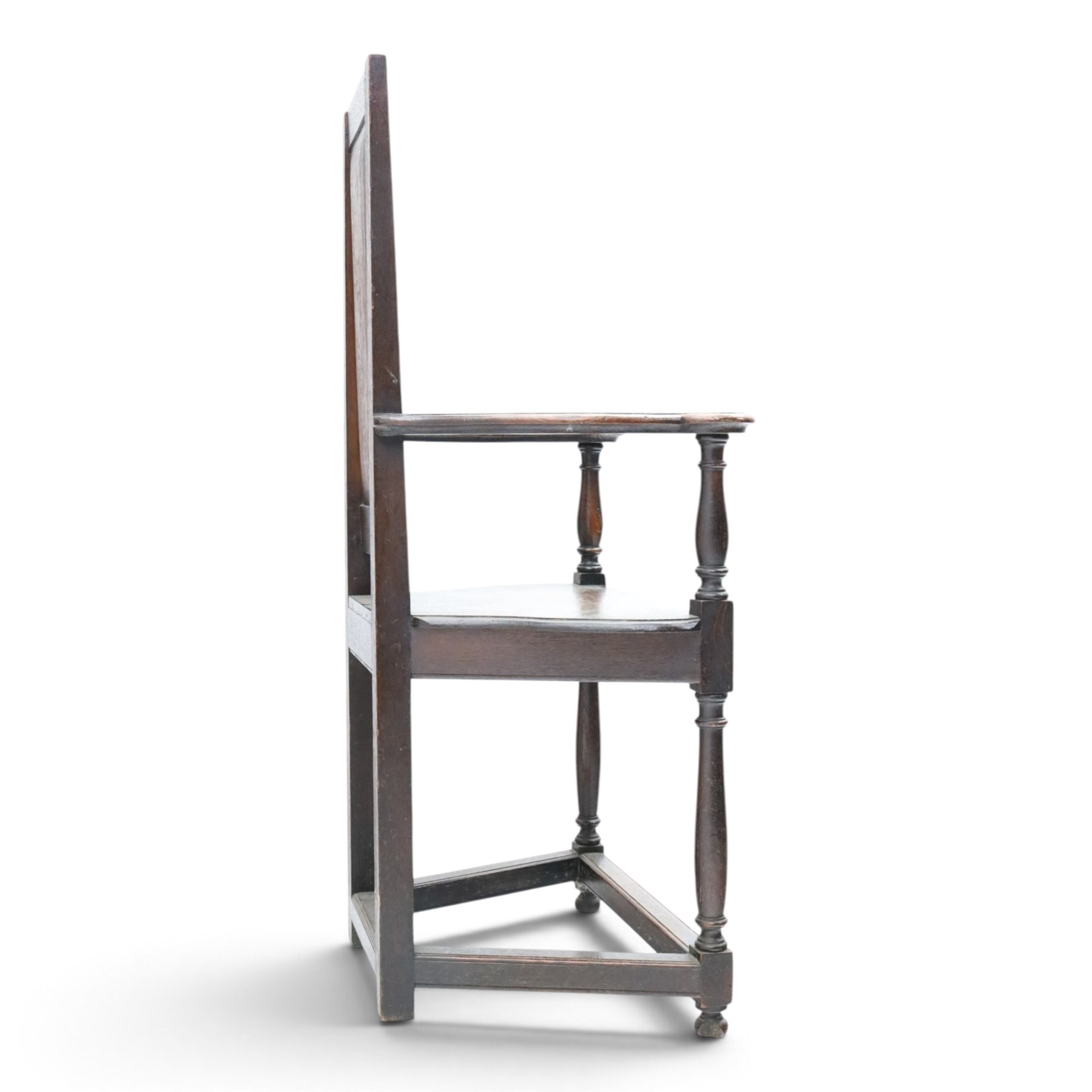 17th design century carved oak hall chair, carved back with urn and foliate details, shaped seat and arms, raised on turned supports united by stretchers