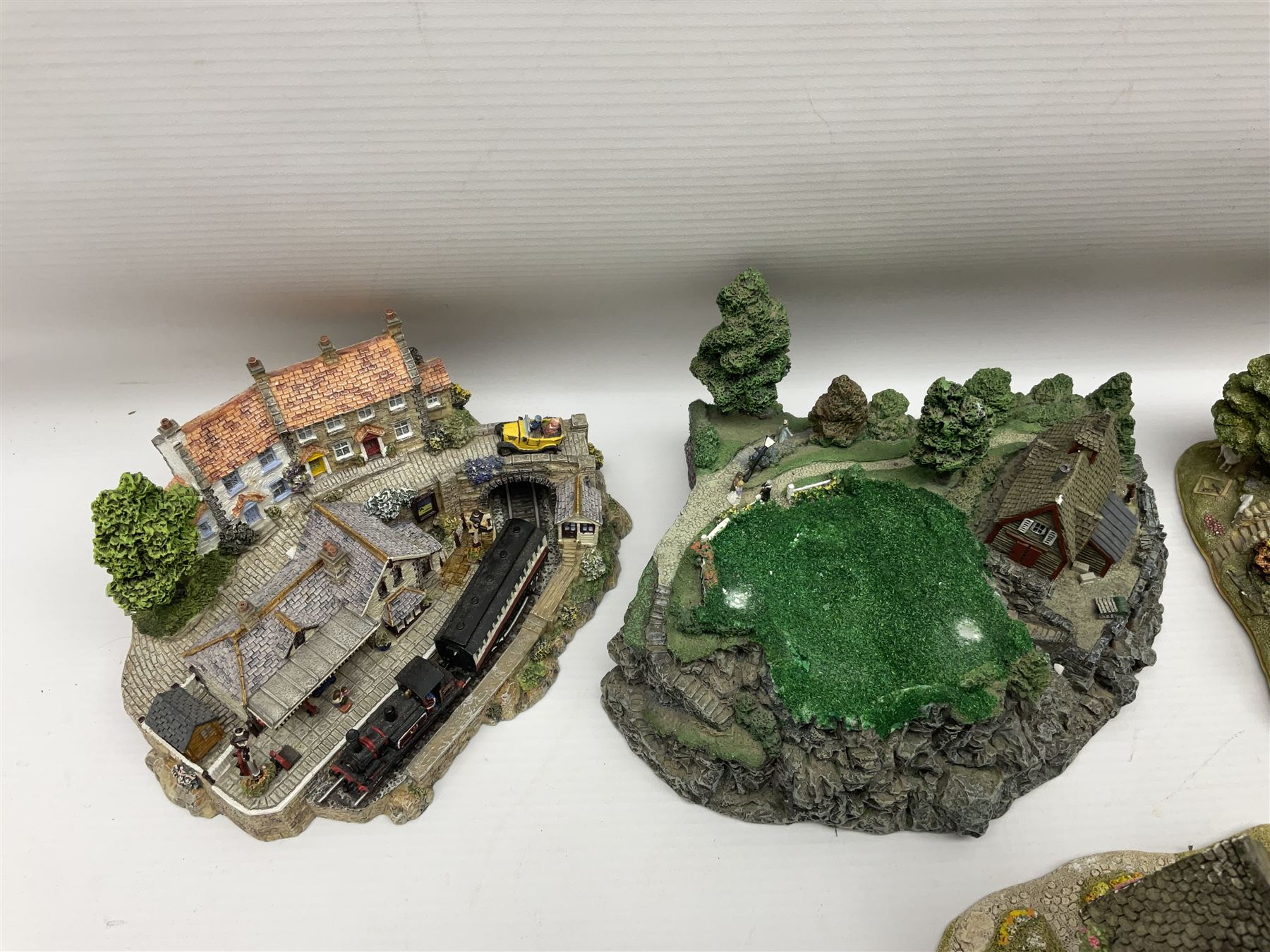 Twenty six Lilliput Lane models, to include Golden Harvest, Junk and Disorderley, Heaven Lea Cottage, Old Scrumpy Farm, Chantry Chapel Wakefield, etc, together with four similar cottages