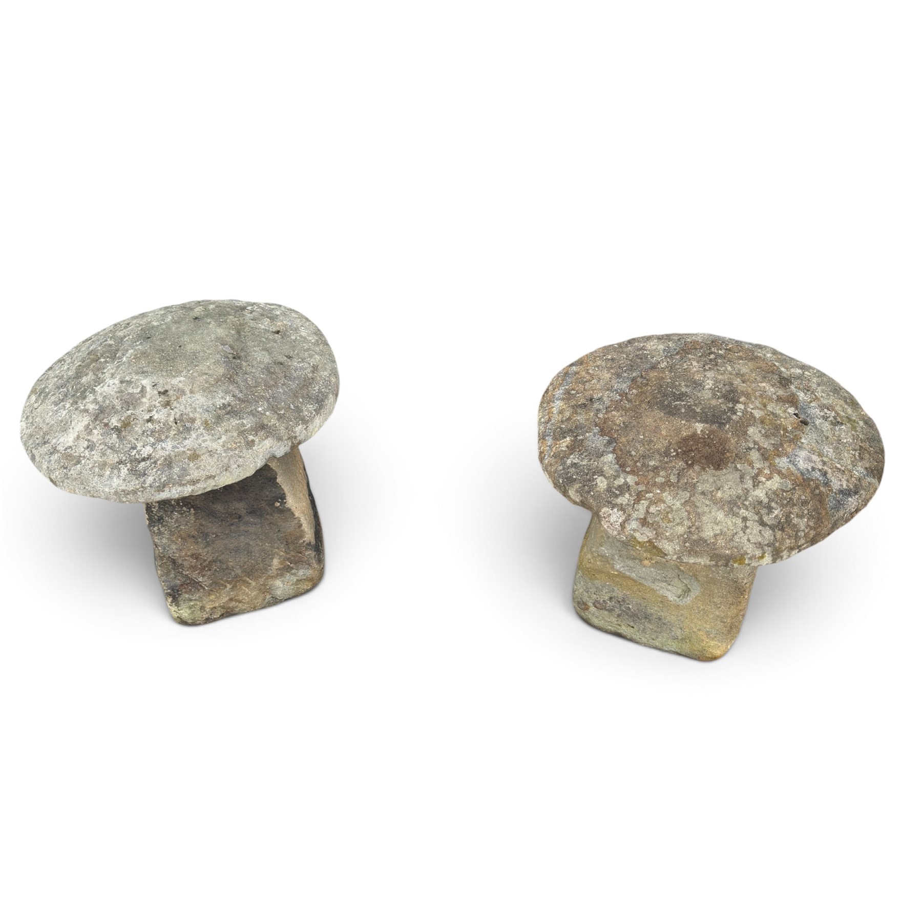 Pair of 19th century weathered hewn sandstone two-piece staddle stones, domed circular top over a tapering base