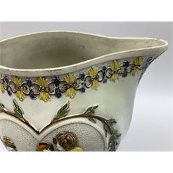 Early 19th century Prattware jug, circa 1800, decorated with two heart shaped panels of children, titled Sportive Innocence and Mischievous Sport, further decorated with acanthus and foliate borders, H22cm