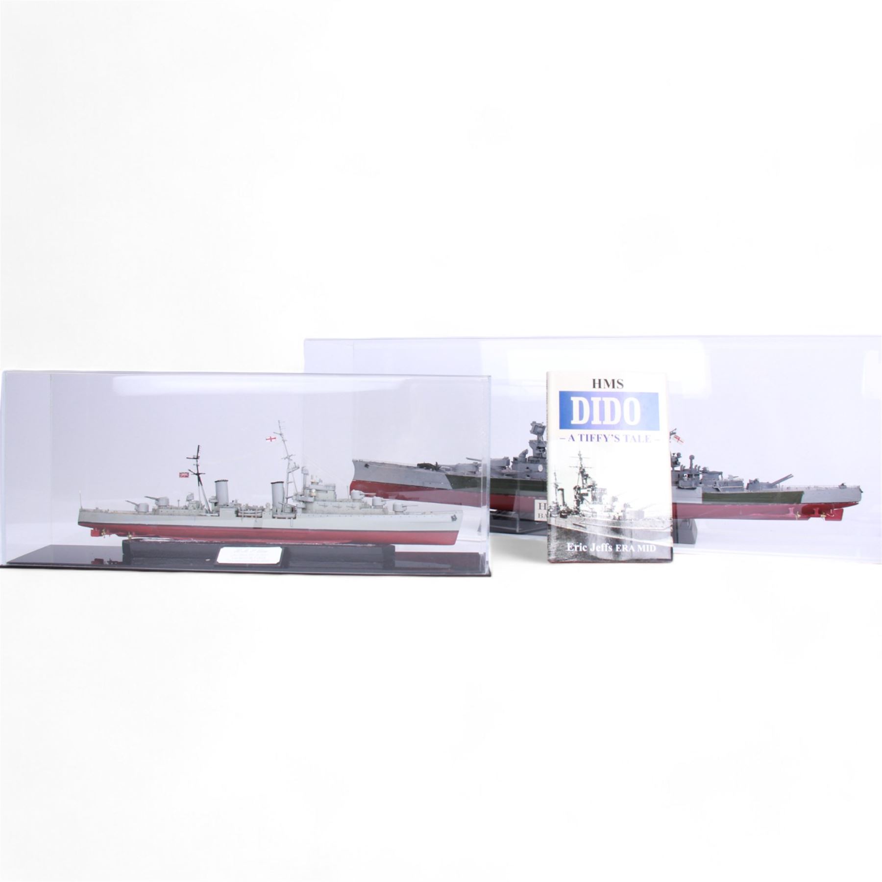 Two ship models in display cases; HMS Repulse, 1941 and HMS Dido, 1939, together with a book about HMS Dido, largest H27cm 
