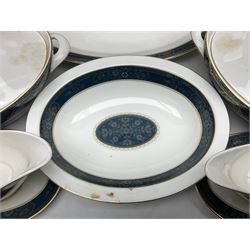 Royal Doulton Carlyle pattern dinner service for twelve, comprising twelve dinner plates, twelve smaller plates, twelve side plates, twelve soup bowls, twelve dessert bowls, two sauce boats and stands, two lidded tureens, two oval serving plates and vegetable dish, all seconds with scratched stamped marks beneath