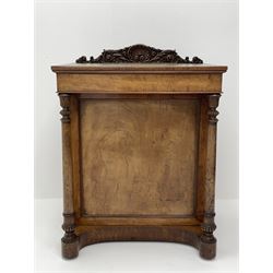 Early Victorian figured mahogany dressing cabinet, the raised shell and scroll carved back lifts to reveal rectangular easel mirror with mahogany band, flat rectangular top with tooled leather inset, slide at each side with matching leather inset, full width drawer above cupboard enclosing a series of five drawers, turned front supports, panelled front, sides and back