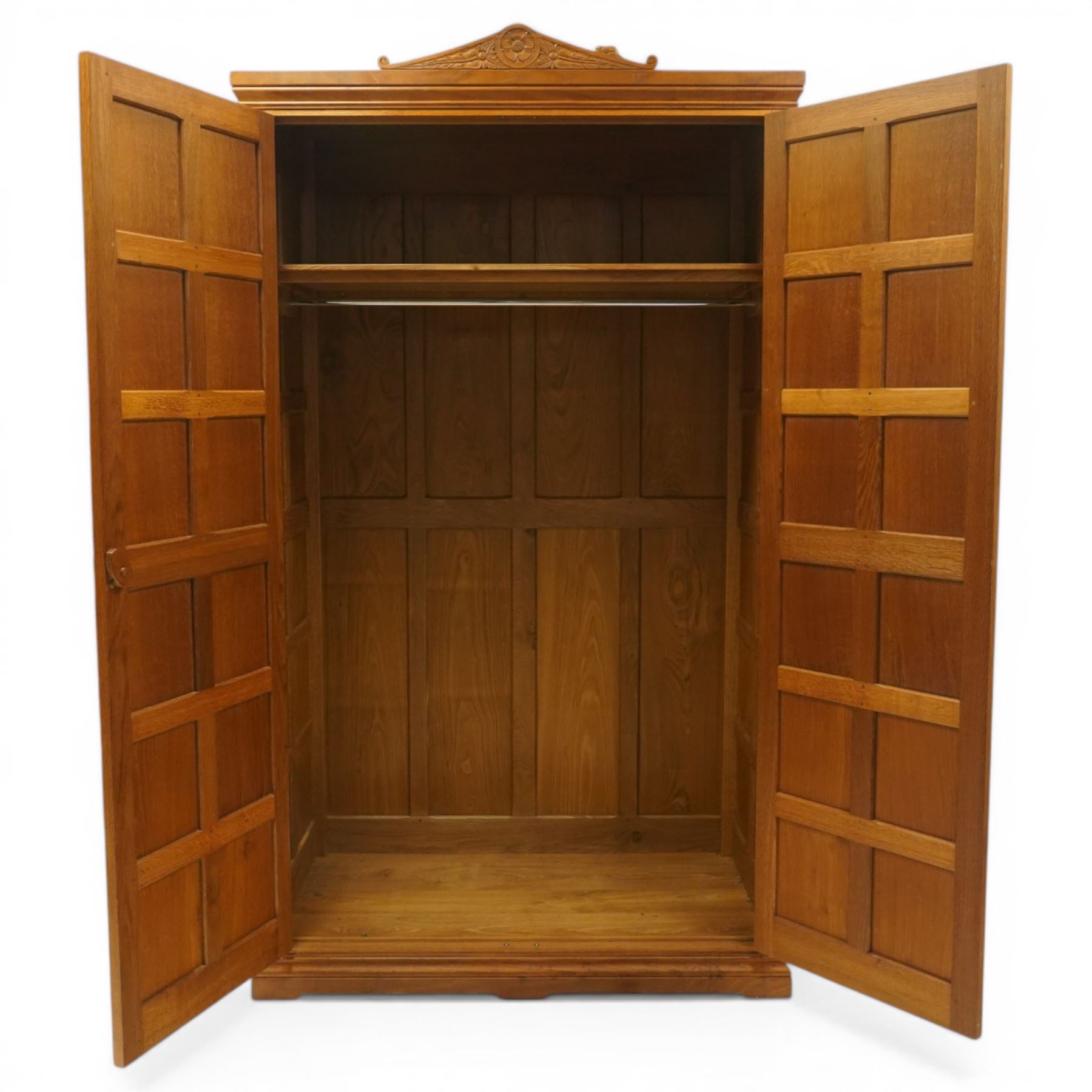 Beaverman - Yorkshire oak panelled double wardrobe, with carved pediment, panelled doors and sides, with internal top shelf above a single hanging rail, with carved beaver signature, by Colin Almack of Sutton near Thirsk