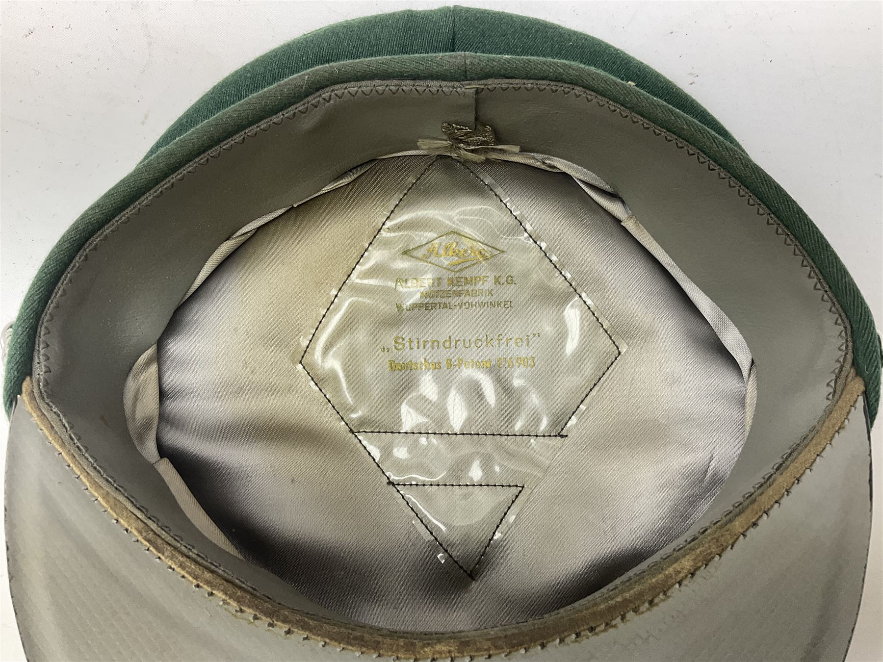 Five reproduction German WW2 hats comprising Wehrmacht olive tropical helmet, Heer officer's peaked cap, two M43 caps and Field side cap (5)