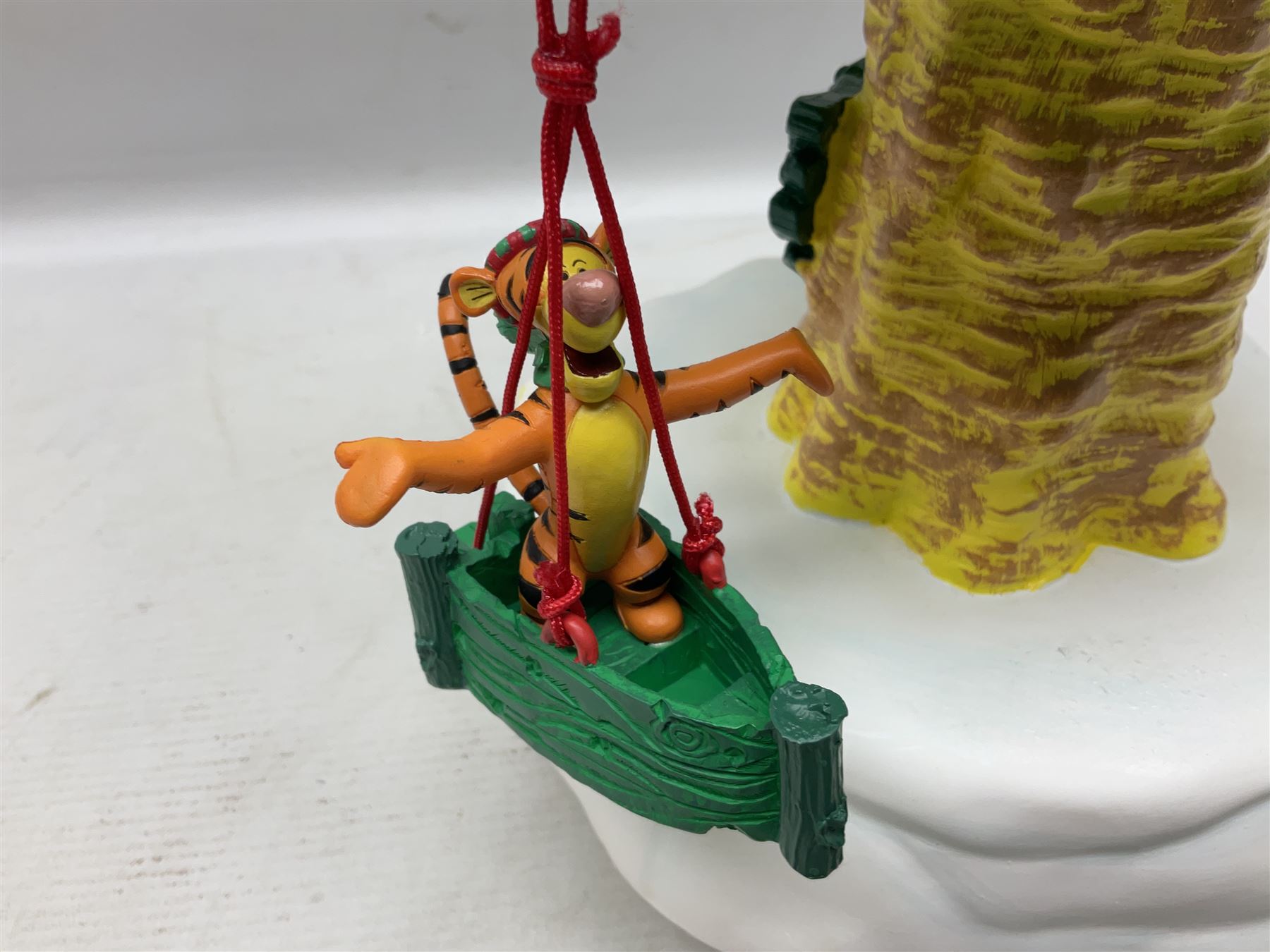 Six Disney Winnie the Pooh Christmas snow globes, comprising large Mr Christmas Holiday Snowfall, An Enchanted Christmas, It's A Small World Christmas 1994,  Tree Trimming, 1995 Christmas At Our House and Christmas Band Concert, together with Mr Christmas Holiday Go Round, all with boxes (7)