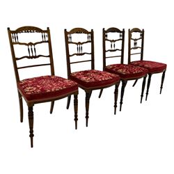 Edwardian inlaid rosewood salon suite, upholstered in red and gold fabric, comprising two seat sofa, pair of tub shaped armchairs, and four side chairs