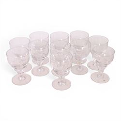 Georgian shaped drinking glasses, comprising eleven larger, H12.5cm, and eight smaller, H10.5cm, each with ovoid bowl upon knopped stem and circular foot