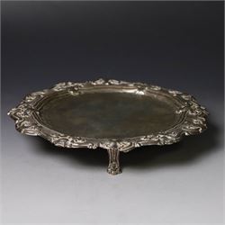 19th century continental silver waiter, of hexagonal form with stipple and scroll border, engraved with floral decoration to centre, upon three stylised paw feet, W19.2cm