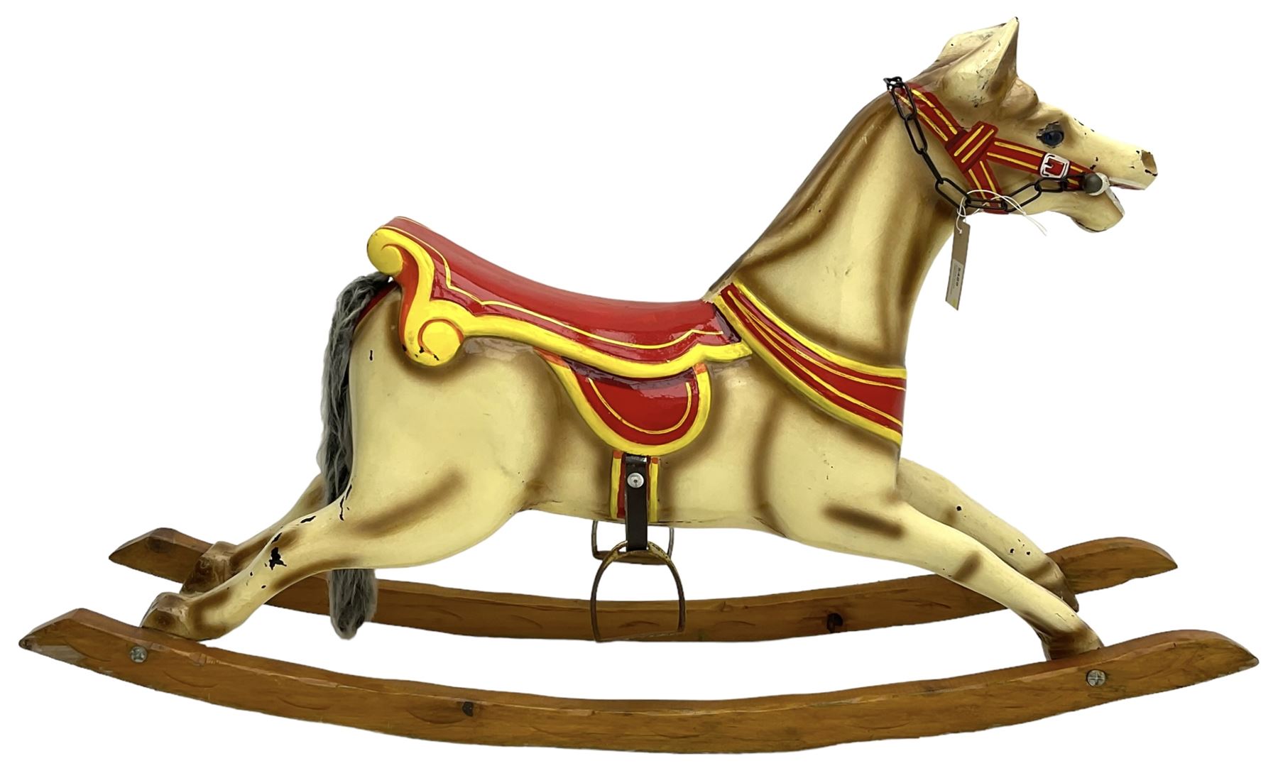 20th century rocking horse, painted body, glass eyes, metal stirrups and chain, wooden bow rocker