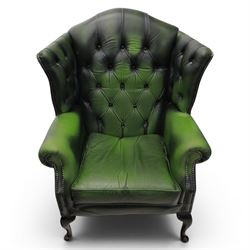 Thomas Lloyd - Pair of Queen Anne design wingback armchairs upholstered in buttoned green leather, button back and scrolled arms, raised on cabriole supports. 