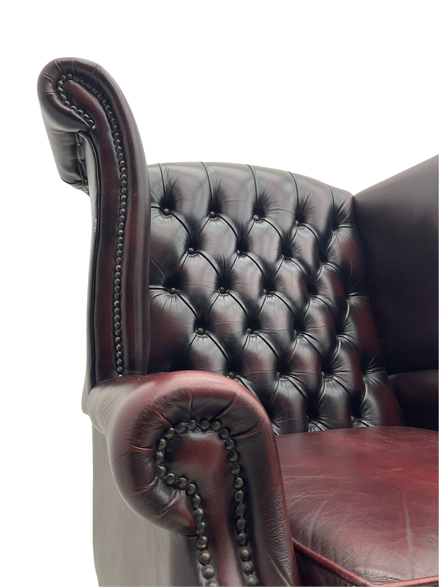 Thomas Lloyd - Georgian style wing back armchair, upholstered in buttoned oxblood leather