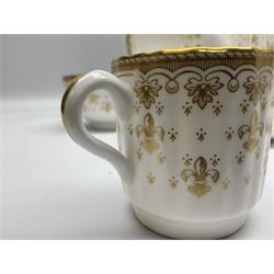 Modern Spode coffee and dinner wares for six place settings, decorated in the Fleur De Lys Gold pattern, comprising dinner plates, dishes, side plates, one handled fan shaped serving dish, coffee pot, coffee cans, saucers, open sucrier and cream jug, with red and black printed marks beneath 
