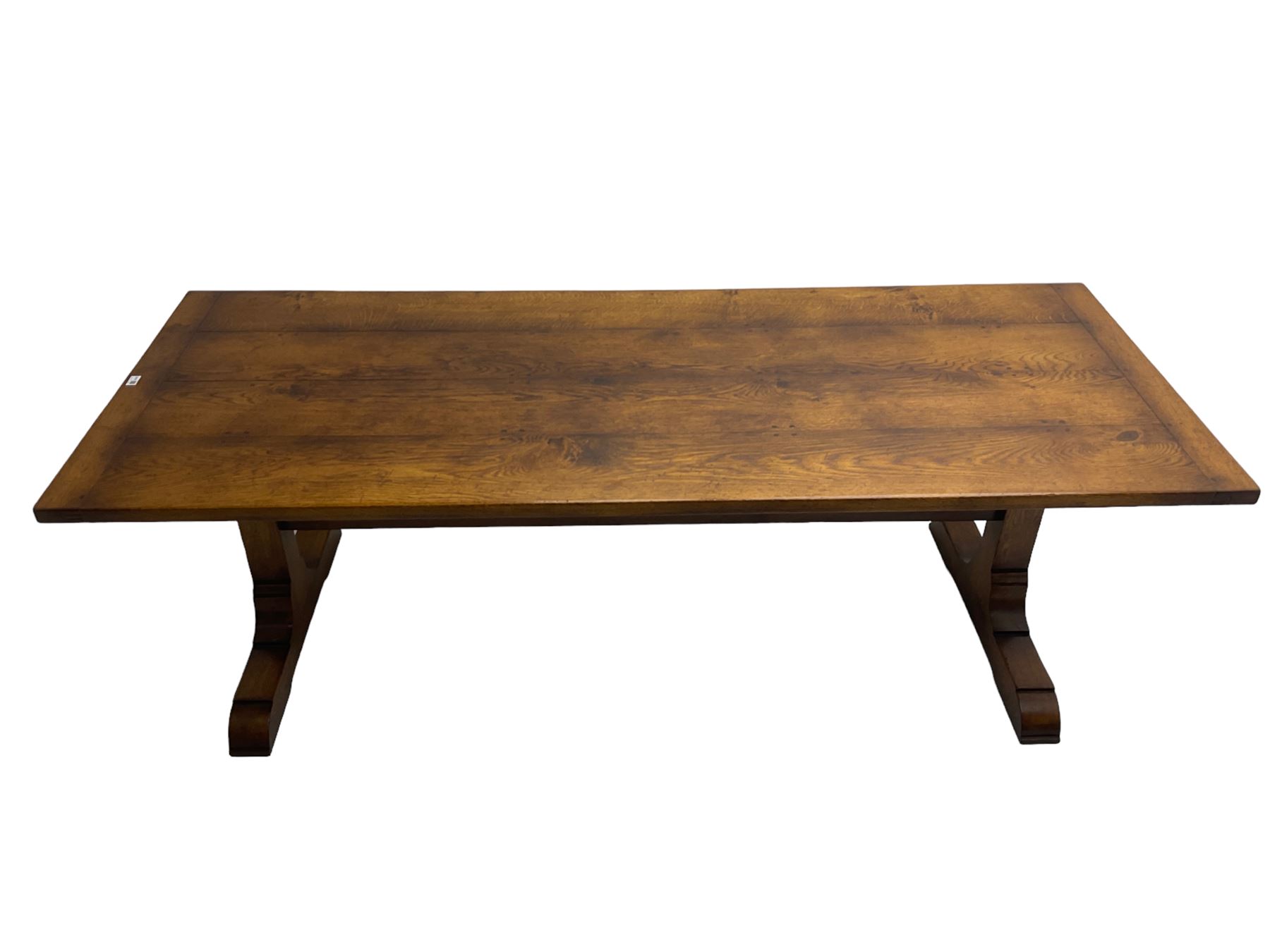 Dorset Oak - large refectory dining table, rectangular plank top, raised on shaped end supports with sledge feet, united by stretcher