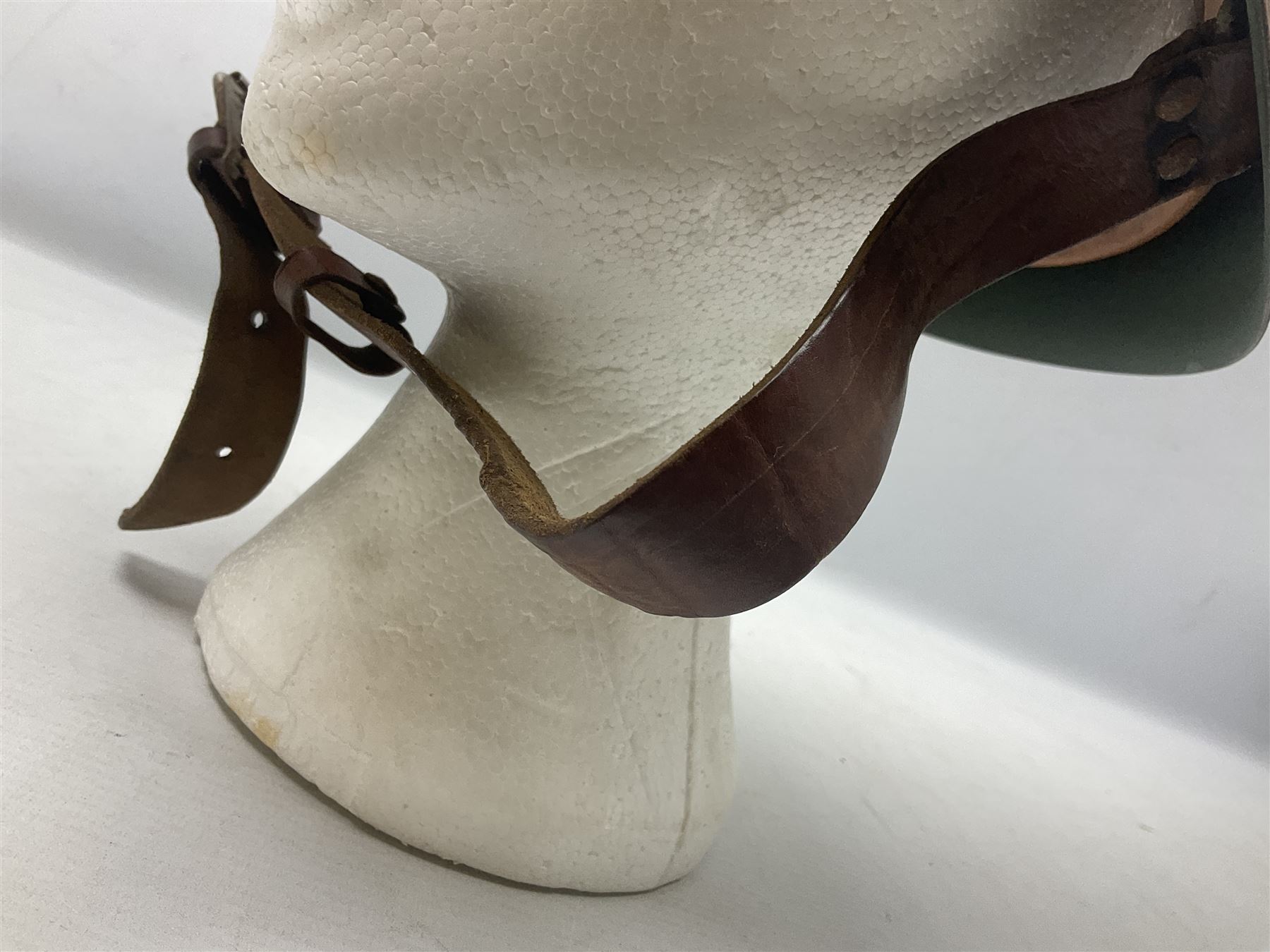 1960s Italian parachutist helmet with liner; camouflage paintwork with parachutist crest to the front