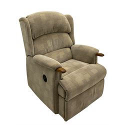 Reclining armchair upholstered in cream fabric