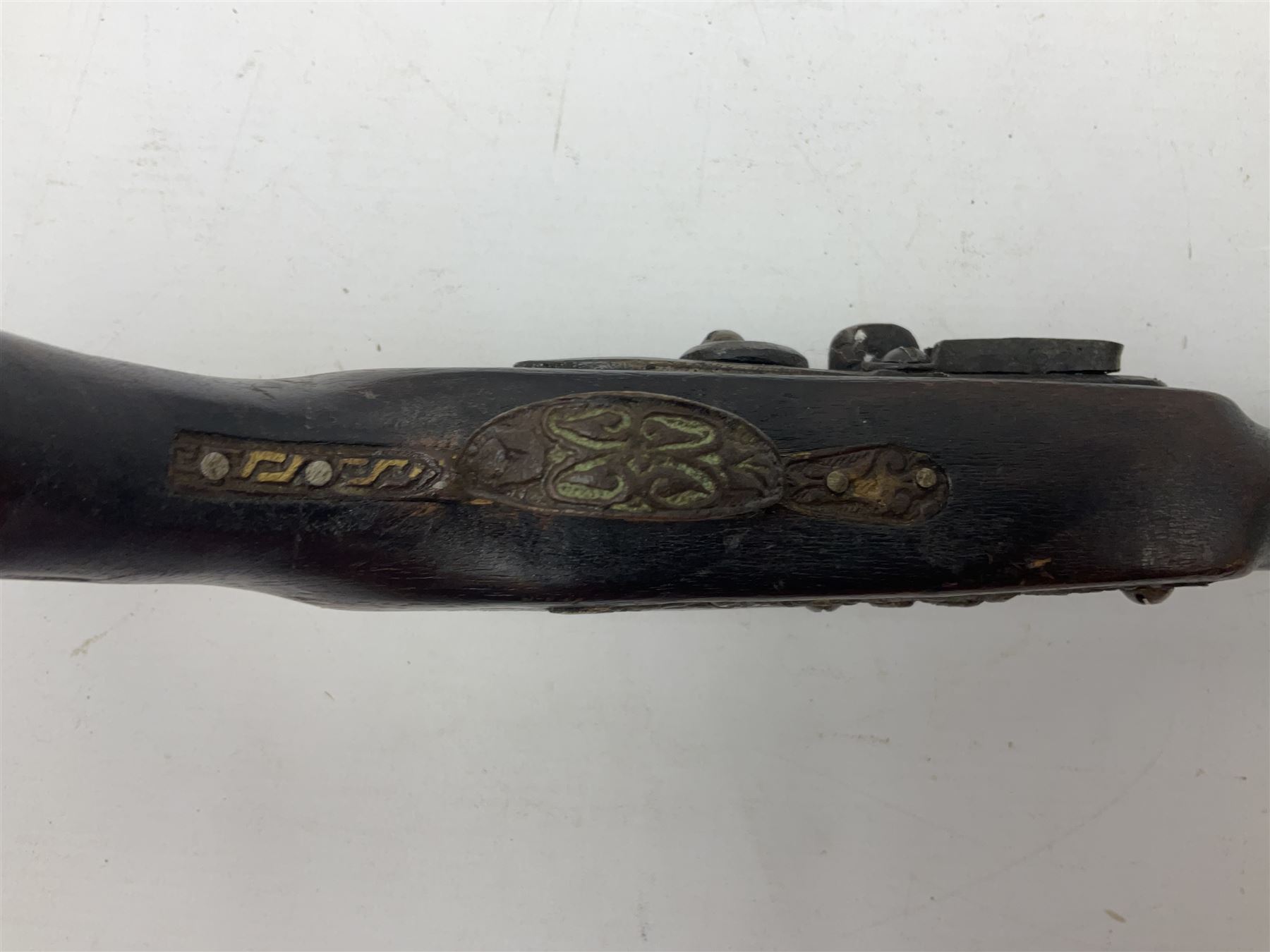 Reproduction flintlock pistol, the full walnut stock with brass filigree inlay and mounts and skull crusher butt L46cm; no visible proof marks FIREARMS CERTIFICATE REQUIRED OR RFD