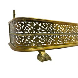 Victorian brass fire fender with companion set, D-shaped form and decorated with pierced and engraved trailing foliage with thistles, on three stepped and shaped feet