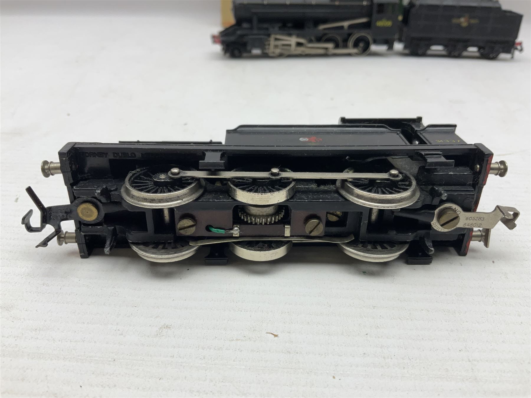 Hornby Dublo - 2-rail - Class 8F 2-8-0 locomotive No.48109 in BR black; Class R1 0-6-0 tank locomotive No.31337 in BR black; and Met-Vic Diesel Co-Bo locomotive No.D5702 in BR green; together with 3-rail Class 4MT Standard Tank 2-6-4 locomotive No.80054 in BR black; three unassociated boxes and one unboxed (4)