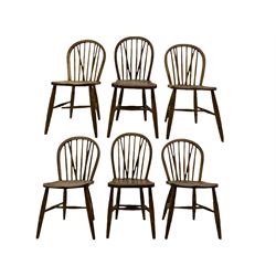 Set of six early to mid-20th century Windsor type elm and beech chairs, hoop and stick back with dished seats, on turned supports with H shaped stretcher