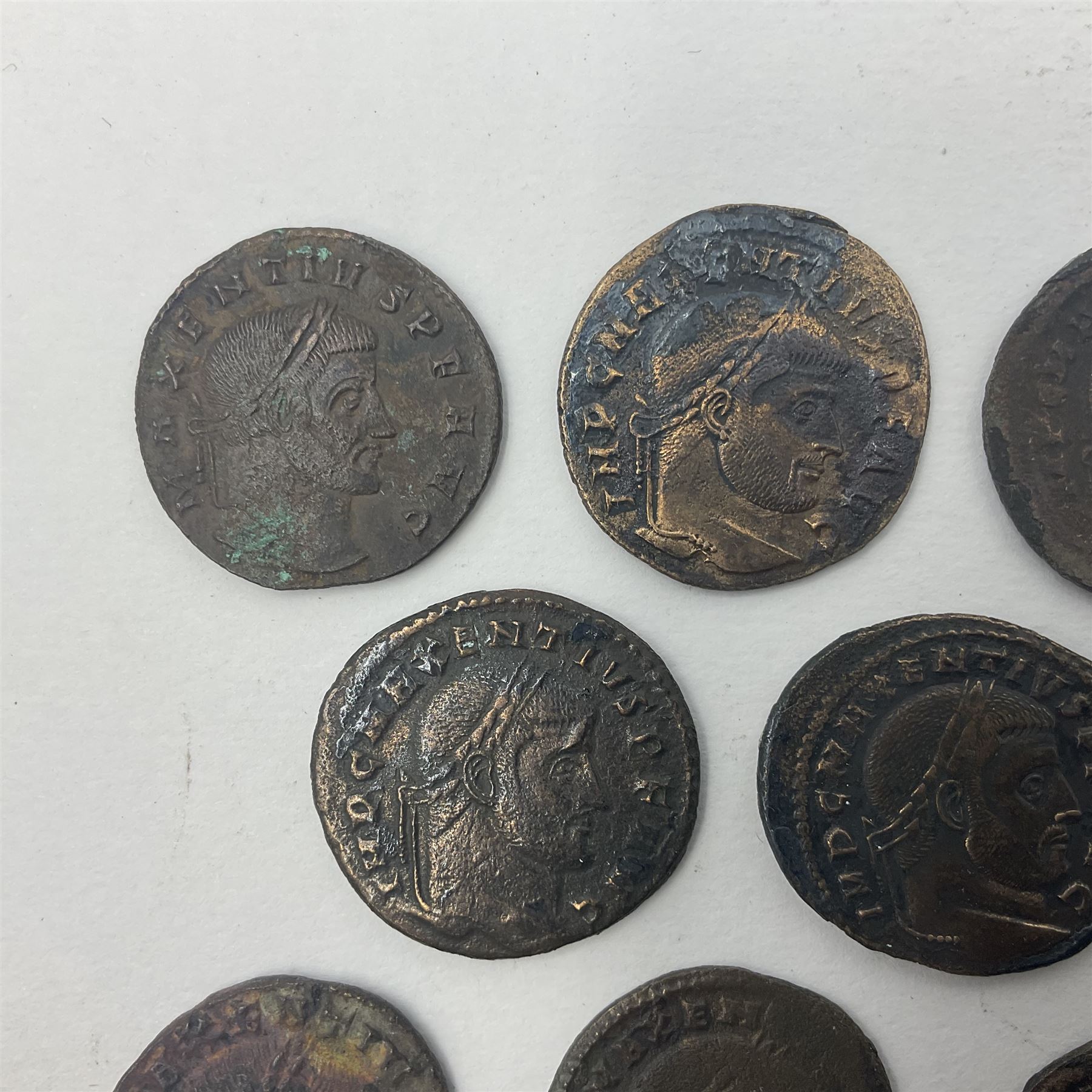 Roman Imperial Coinage, Maxentius (AD 306-312), fourteen bronze folles, most bearing rev. Roma seated in temple holding globe and sceptre (14)