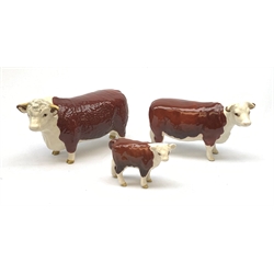 A Beswick Hereford Bull, Hereford Cow, and Hereford Calf, each with printed mark beneath, Bull and Cow marked CH of Champions. 