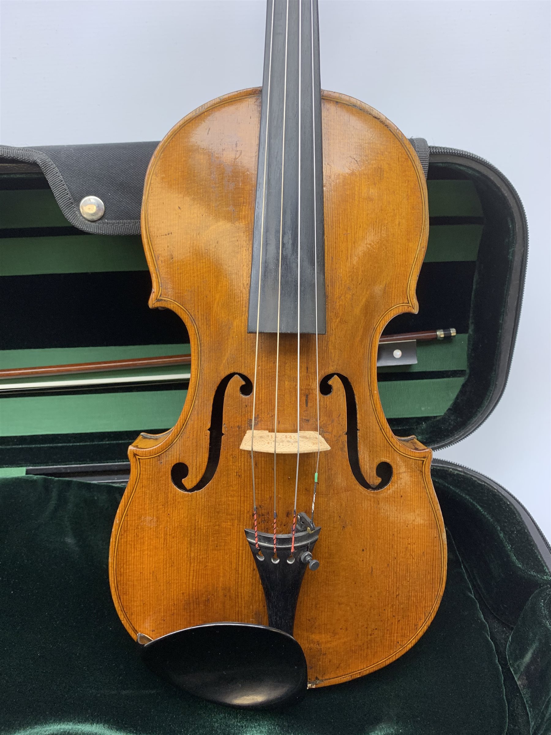 Late 19th century continental violin, possibly Italian, with 36cm two-piece maple back and ribs and spruce top, bears label 'Antonius Stradivarius Anno 1721', 60cm overall; in modern carrying case with silver mounted pernumbuco bow