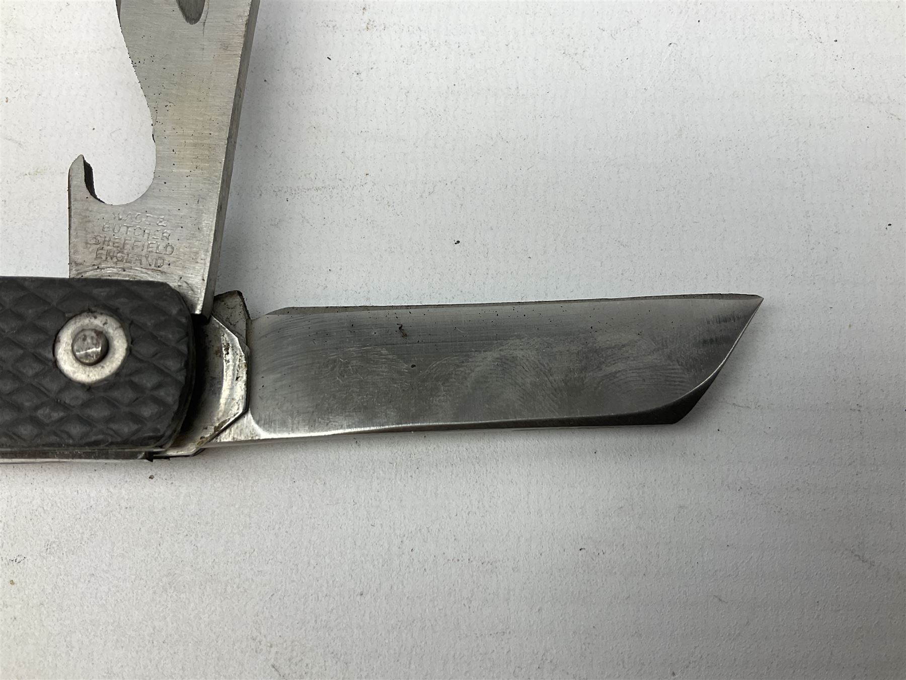 WW2 British army folding jack/clasp knife with blade and can opener marked with broad arrow and date 1944; a similar unmarked British army folding three-blade knife; and another later similar British Army knife marked Wade & Butcher Sheffield England (3)