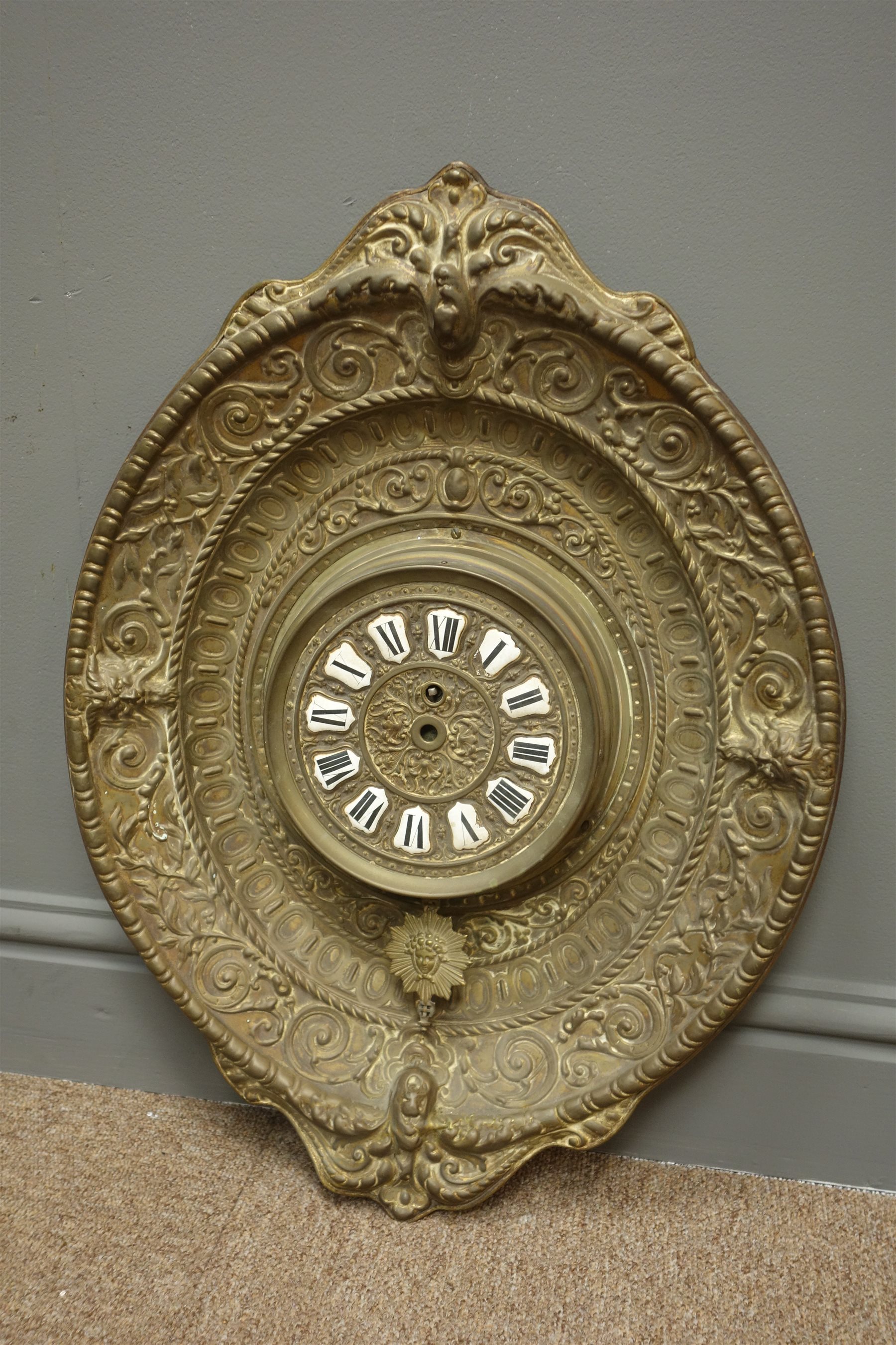 20th century French brass wall clock, white enamel numerals in embossed