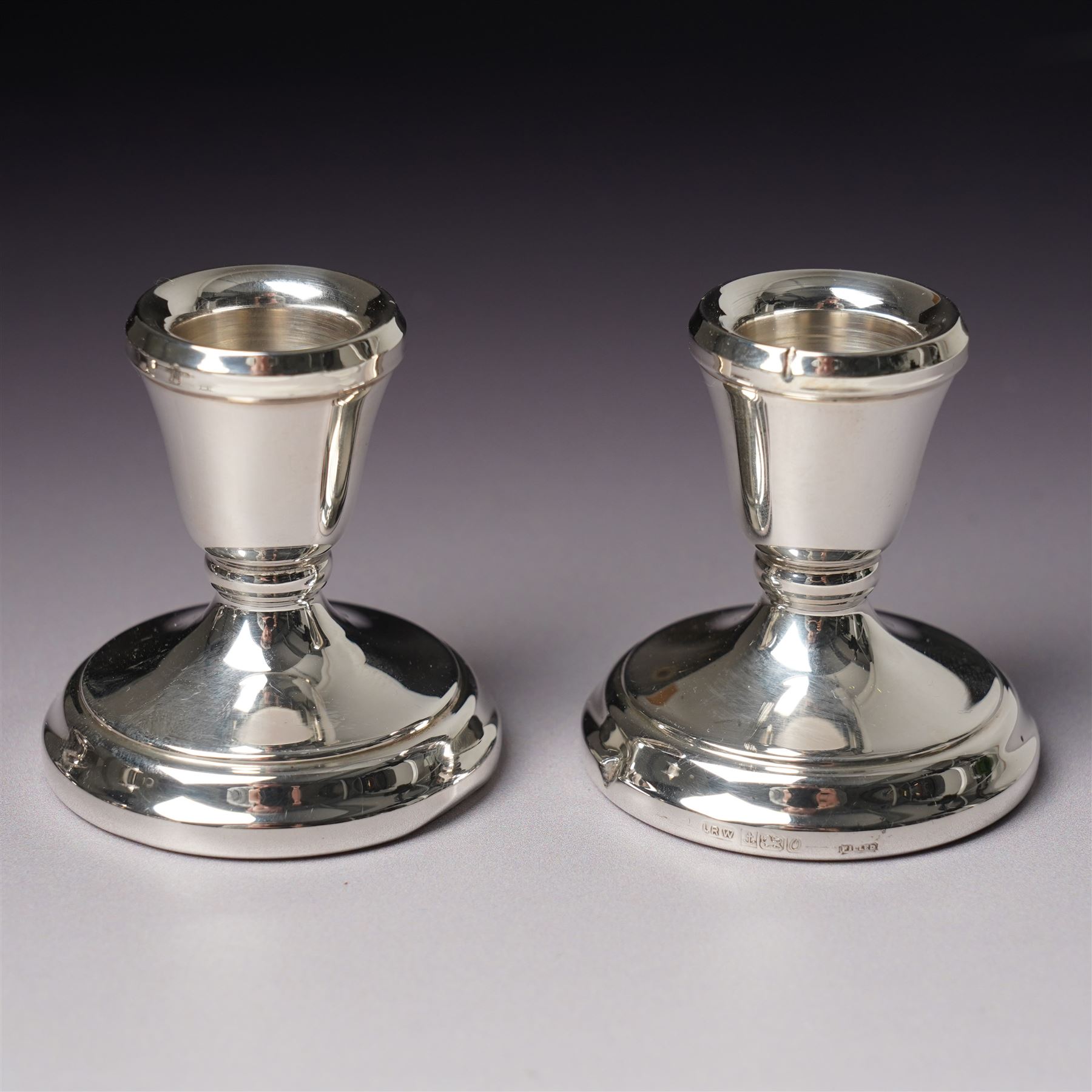 Georgian design silver cream jug Birmingham 1901 Maker George Unite, three piece silver condiment set Birmingham 1940, pair of small silver dressing table candlesticks and three condiment spoons