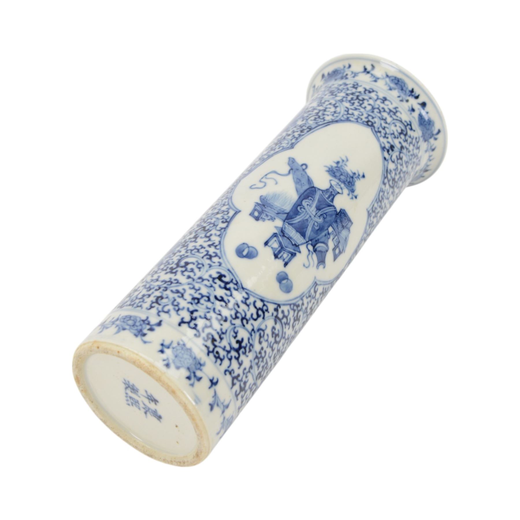 Chinese blue and white cylinder vase, the central panel decorated with vases and domestic objects, with a scrolling floral design, with character marks beneath, H30cm