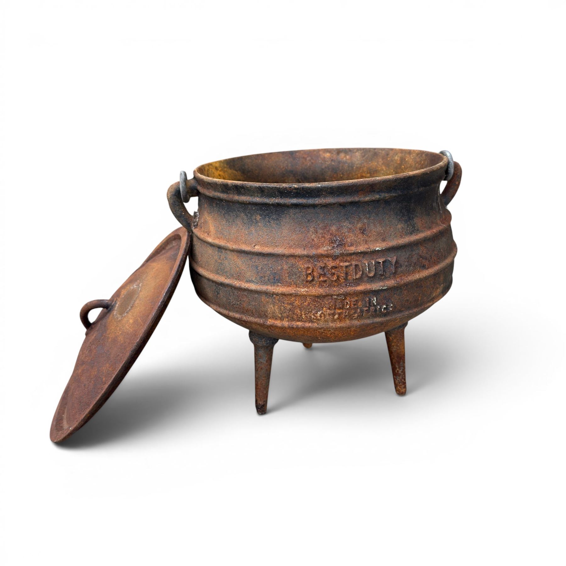 Three South African cast iron graduating cooking pots with lids and handles. Size shown for the largest