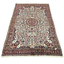 Persian Bidjar ivory ground carpet, decorated all-over with stylised floral motifs and interlacing branch, five band border decorated with flower heads 