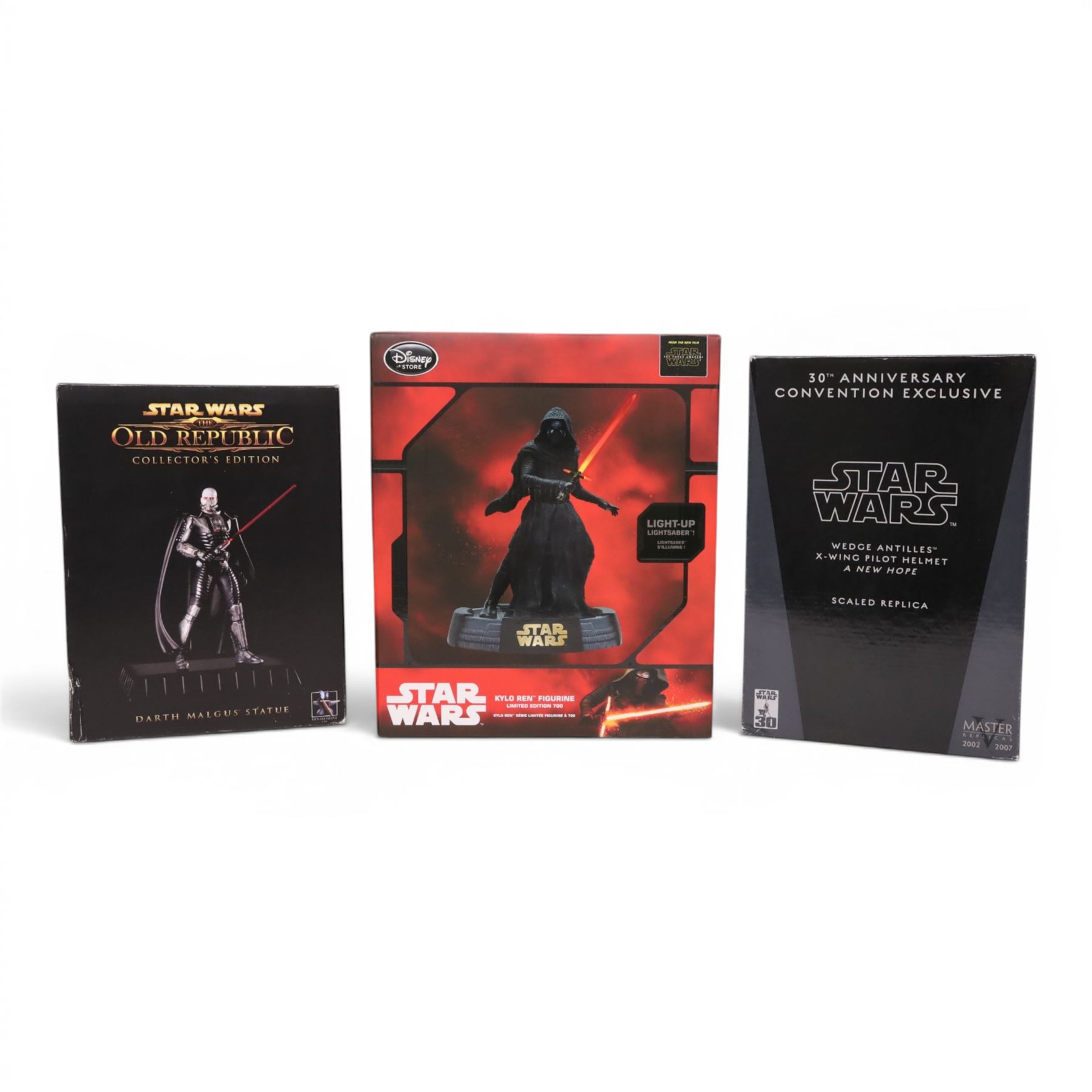 Three Star Wars models, comprising Master Replicas A New Hope Wedge Antilles X-Wing Pilot Helmet scale replica, Gentle Giant Darth Malgus Statue and a Disney Store limited edition Kylo Ren figurine, all boxed 