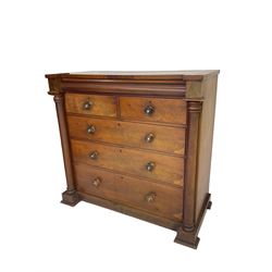 Late 19th century flame mahogany chest, disguised frieze drawer above two short and three long drawers with wooden handles, flanked by turned pilasters, on plinth base with stepped feet