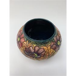 A Moorcroft vase, of squat baluster form, circa 2000, decorated in the Cosmos pattern, with impressed and painted marks beneath, H10.5cm. 