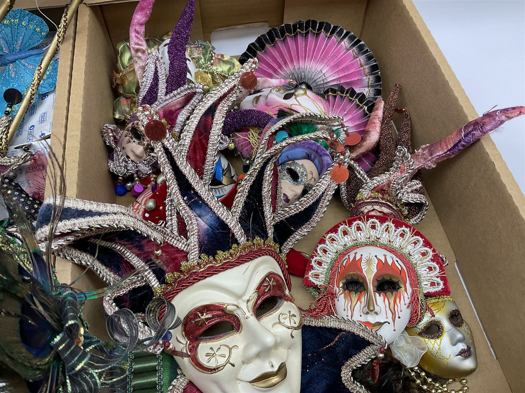 Large collection of decorative Venetian masks, to include two bearing tags for La Maschera Del Galeone, in two boxes 