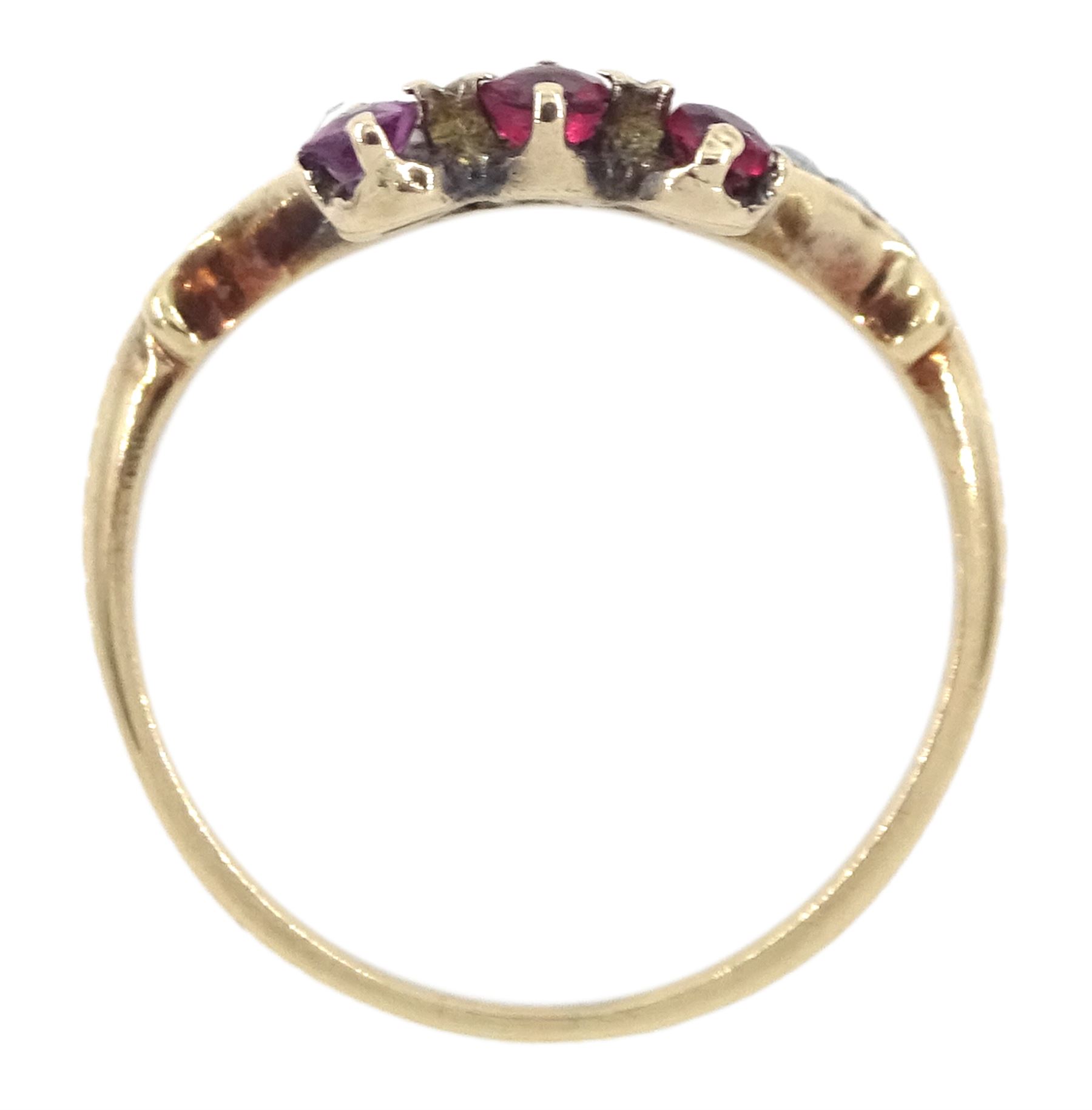 Victorian 9ct rose gold red paste and seed pearl ring, oval paste stone within a scrolling border of seed pearls, surmounted with round cut red paste stones