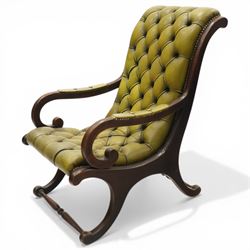 Regency design slipper chair upholstered in buttoned green leather, down swept arms with padded sections, swept back and shaped frames