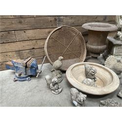 Small Victorian style cast iron urn, cast stone griffin on plinth, 13 garden figures, old vice and other items. 