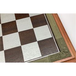 Danbury Mint 'The Fantasy of the Crystal' chess set consisting of mythical pewter chess pieces within a wooden case with chess board lid, together with 16 additional chess pieces in a wooden display case.