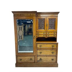 Victorian figured oak and pollard oak combination wardrobe, projecting dentil cornice, the left hand side enclosed by large bevelled mirror glazed door over drawer, the interior with sliding hanging rail, the right hand side with cupboard enclosed by two panelled doors relief carved with urn and trailed trailing foliage, four small drawers over shelf, three drawers and brushing slide, the slide with tooled and gilt blue leather inset, plinth base