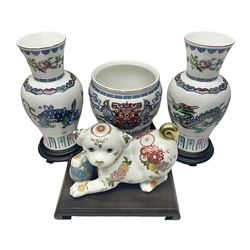 Franklin Mint Chinese style ceramics, comprising two vases, puppy and a planter, all on wooden stands