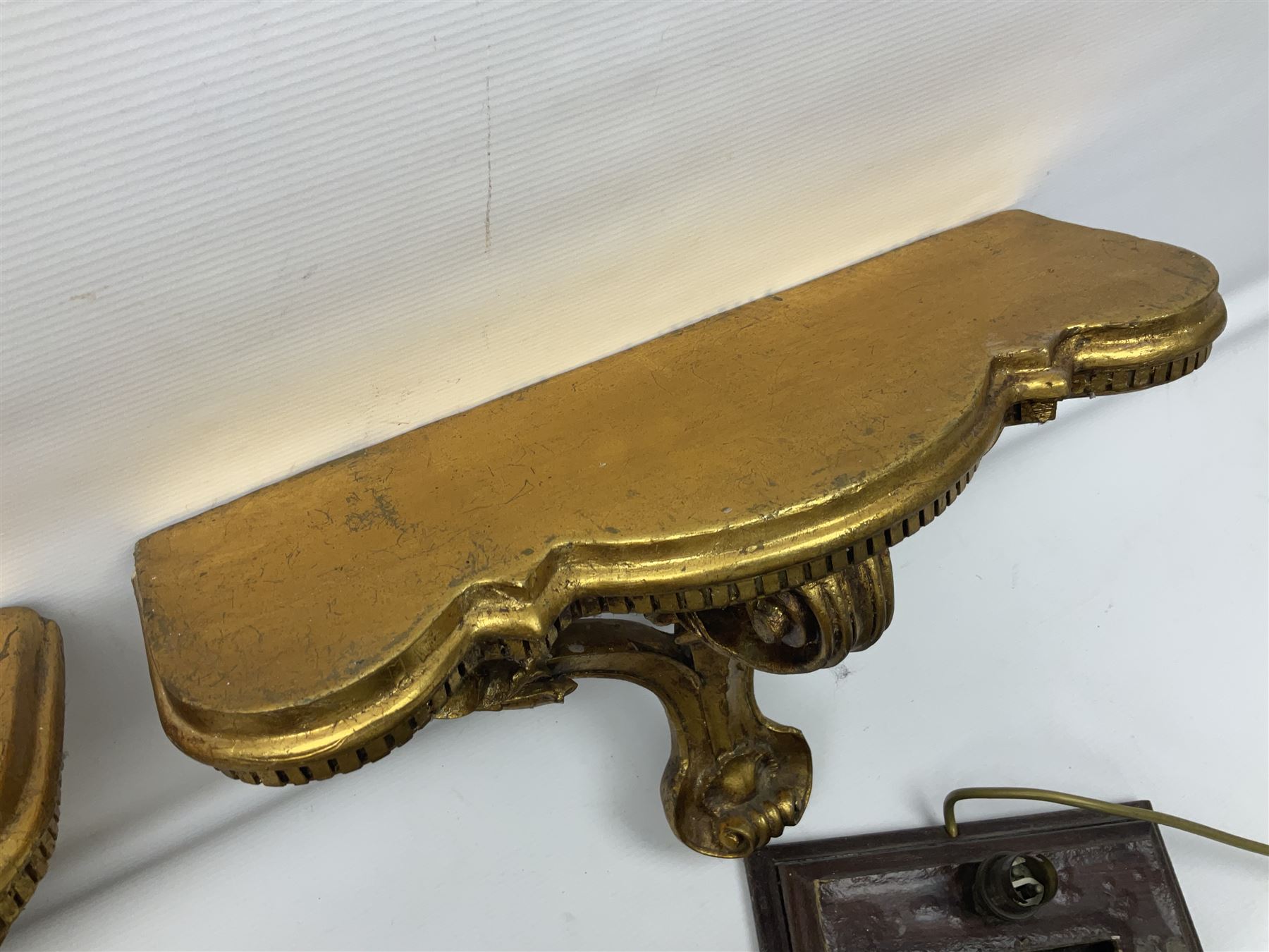 Five various giltwood and other hall brackets, one with marble top; and Viking ship table lamp