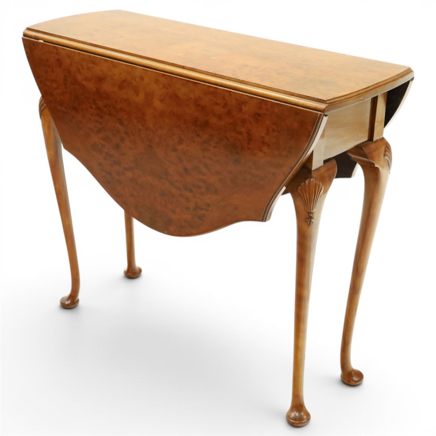 Queen Anne design walnut drop-leaf table, figured top with serpentine drop leaves, shell carved knees on cabriole supports