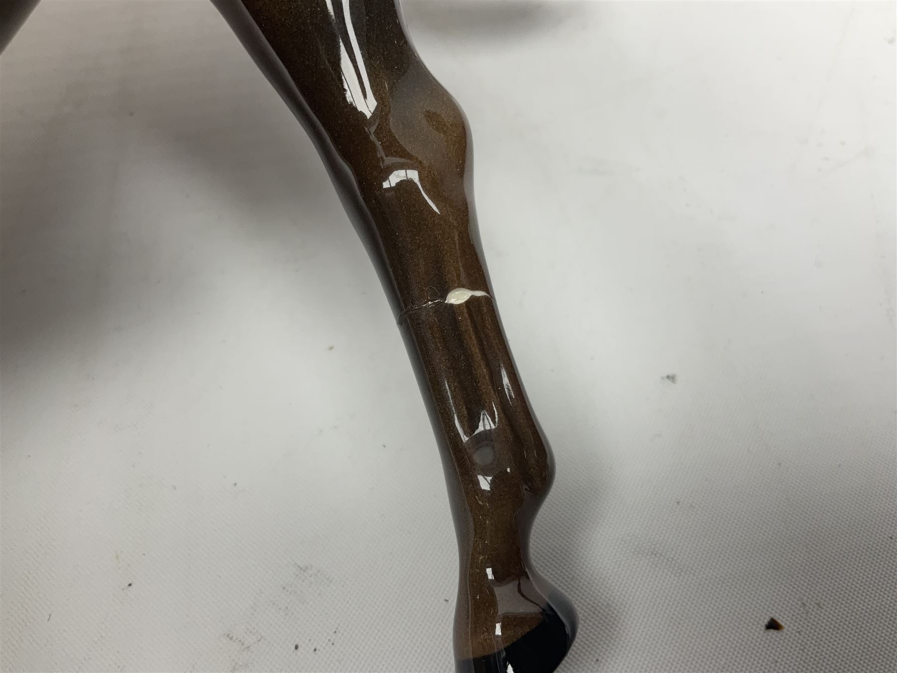 Four Beswick horses, including Exmoor no 1645, Black Beauty foal and two others 