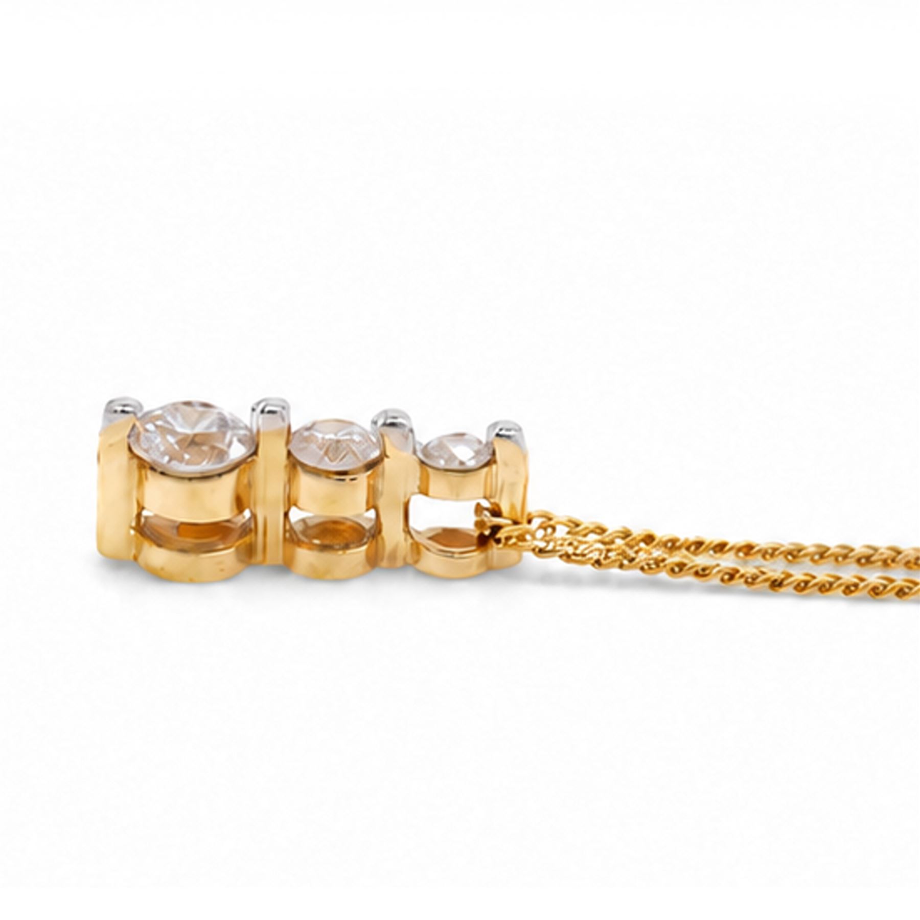 18ct gold diamond pendant necklace, set with three graduating round brilliant cut diamonds, total diamond weight 0.25 carat