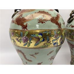 Pair of early 20th century Chinese vases decorated with dragons chasing a flaming pearl, with a gilt border of butterflies and floral sprigs, with Elephant head handles, H44cm 